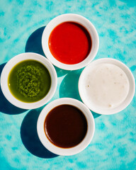 4 types of different sauces for dishes, served in cafes and restaurants