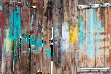 The texture of weathered wooden wall. Aged wooden plank fence of vertical flat boards