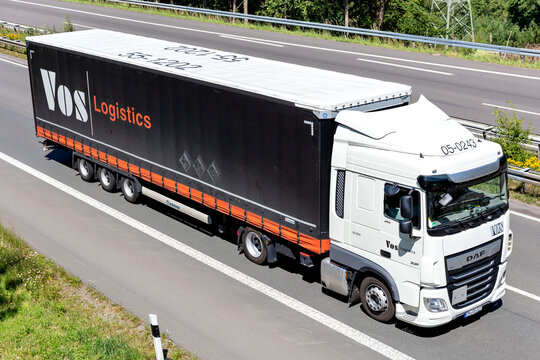 WIEHL, GERMANY - JUNE 24, 2019: VOS DAF XF truck with curtainside trailer on motorway.