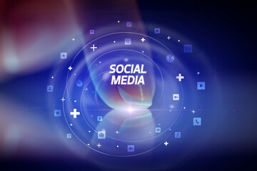 Finger touching tablet with social media icons and SOCIAL MEDIA