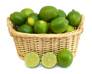 Fresh ripe lime isolated in basket on white background