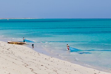 Fototapeta na wymiar Fishermen on the beach, salary bay, Madagascar 