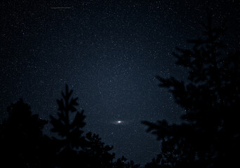 night sky and the visible andromeda galaxy