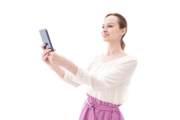 Fototapeta premium セルフィーを撮影する若い女性