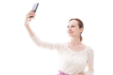 Naklejka premium セルフィーを撮影する若い女性