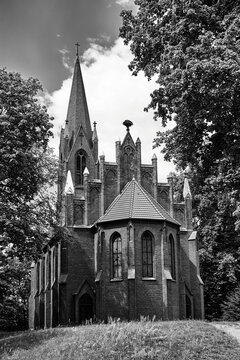 The tower of the historic, neo-Gothic red brick church in the village of Chycina