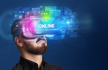 Businessman looking through Virtual Reality glasses with ONLINE inscription, innovative security concept