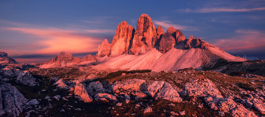 Fantastic colorful scenery in mountains during sunset. Tre Cime di Lavaredo with colorful dramatic sky under sunlight. Fabulous landscape of one most popular place in Dolomites. Italy, Europe © jenyateua