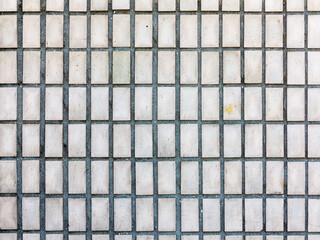 Old outdoor facing tiles for buildings. Abstract geometric architectural background..