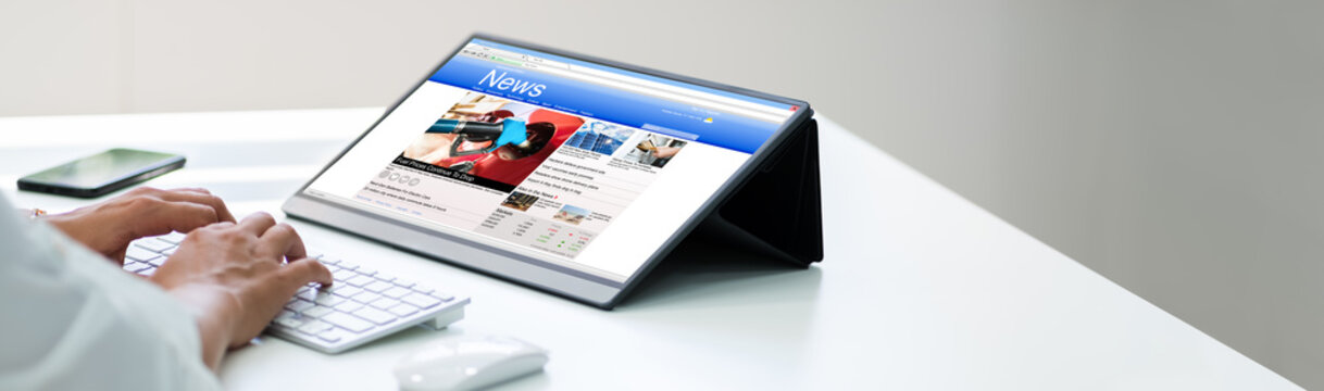 Newspaper Reading Online On Tablet Computer