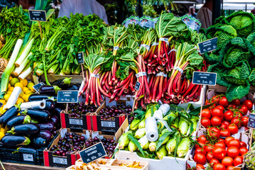 A stall with fresh vegetable in the Torvehallerne gourmet food market located in Norreport, Copenhagen, Denmark.