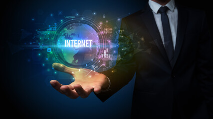 Elegant hand holding INTERNET inscription, digital technology concept