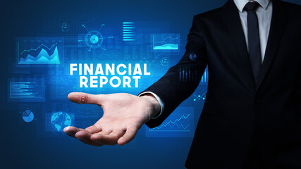 Hand of Businessman holding FINANCIAL REPORT inscription, business success concept