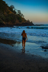 woman in a bikini posing on the beach
