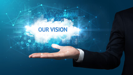 Hand of Businessman holding OUR VISION inscription, successful business concept
