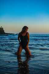 woman in a bikini posing on the beach
