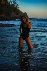 woman in a bikini posing on the beach