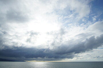 Obraz premium blue sea and cloudy sky over it. Blue Sea sky and Clouds