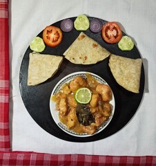 Roti or Ruti with lemon Chicken curry, traditional Bengali lunch