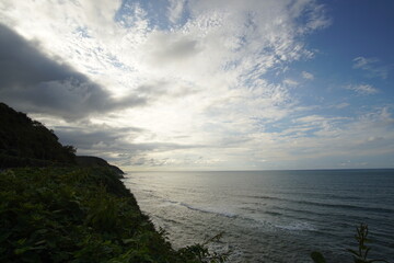perfect blue sky with clouds and water of the sea
