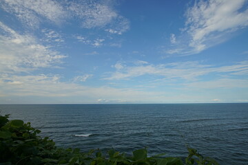perfect blue sky with clouds and water of the sea