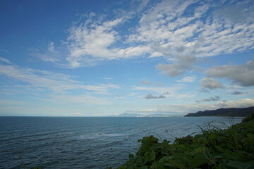 perfect blue sky with clouds and water of the sea