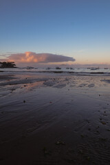 sunrise  on the beach with fishing boats 