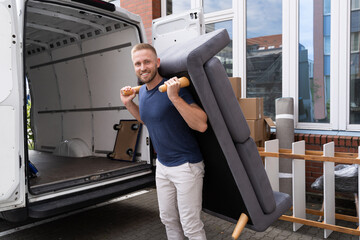 Man Lifting Sofa Or Couch Furniture