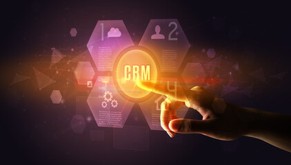 Hand touching CRM inscription, new technology concept