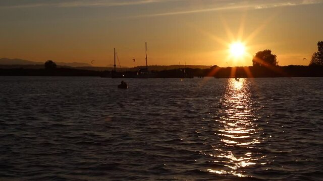 Sunset on Port Gardner Everett WA Small Boat Raft Moves Towards Shore