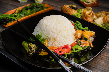 White rice and chicken with vegetables in black bean sauce