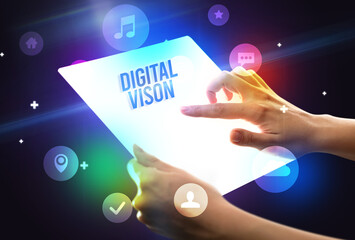 Holding futuristic tablet with DIGITAL VISON inscription, new technology concept