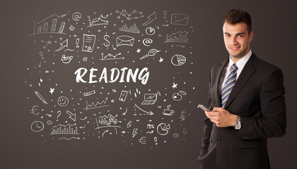 Businessman thinking with READING inscription, business education concept