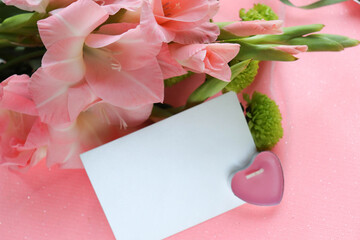 bouquet of pink gladioli and space for text. wedding card. congratulation. invitation