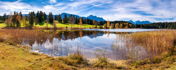 panoramic view to beautiful lake with reflection in Bavaria, Germany