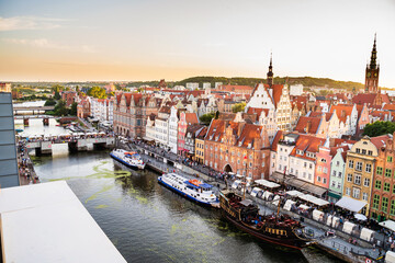 Gdansk, North Poland : Panoramic aerial shot of Motlawa river embankment in Old Town during sunset in summer