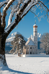 beautiful panoramic landscape in Bavaria at winter with church st. coloman
