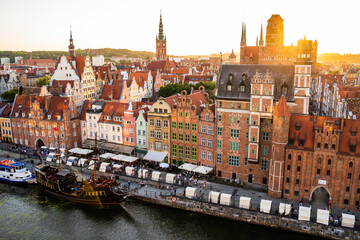 Fototapeta na wymiar Gdansk, North Poland : Wide angle panoramic aerial shot of Motlawa river embankment in Old Town during sunset in summer