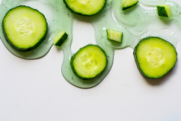 sliced cucumbers on white background