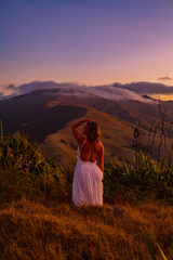 woman on a mountain at sunset