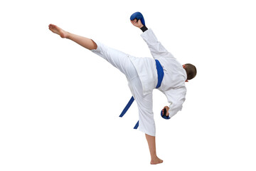 In karategi boy athlete performs a kick on white isolated background