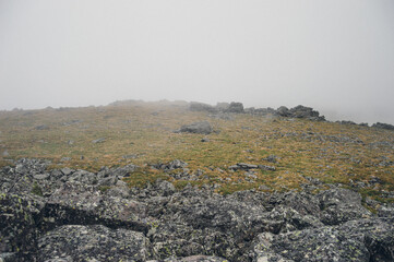 Mountain landscape in the Urals with dense fog