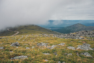 Mountain landscape in the Urals with dense fog