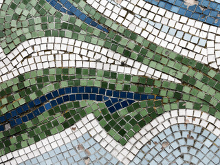 Detail of beautiful old collapsing abstract ceramic mosaic adorned building. Venetian mosaic as decorative background. Selective focus. Abstract Pattern. Abstract mosaic colored ceramic stones