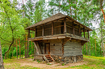 Old Latvian wooden house which represents architectural style  of the country regions.