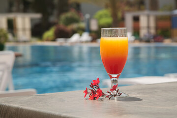 a cocktail on the background of the pool