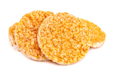 Caramelized rice-corn crispbread, isolated on white background. Sweet puffed whole grain crispbread.