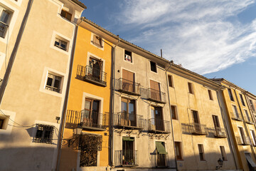 Fototapeta na wymiar Warm color facade of buildings Cuenca city center during summer