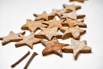 Sweet Christmas tree made with star cookies on white background