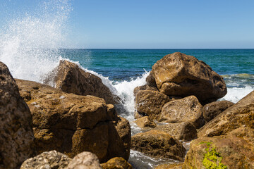 Splashes from a wave splashing on the rocks